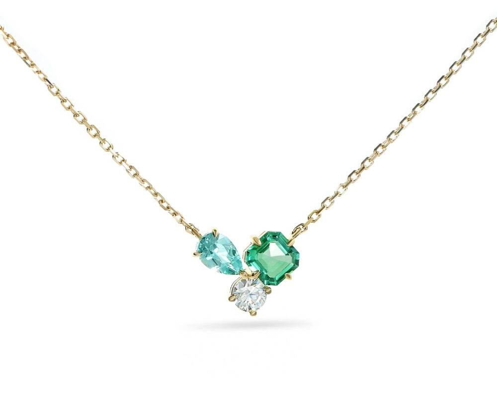 Oro amarillo 18 k con 1 Esmeralda de laboratorio corte asher de 0,5 ct, 1 Paraiba corte pera de 0,5 ct y un circón brillante